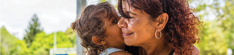 Photo of woman hugging a child