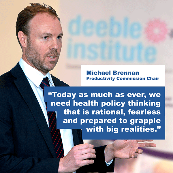 Michael Brennan delivering the speech quoting: Today as much as ever, we need health policy thinking that is rational, fearless and prepared to grapple with big realities.